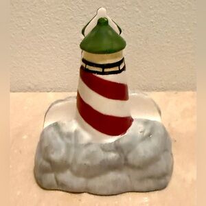 American Atelier at Home “NH Signals” lighthouse napkin holder.